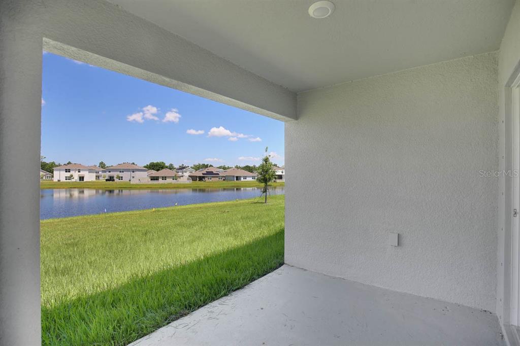 16530 Windmill Forge Pass Wimauma, FL 33598 - Photo 27 of 33 a view of a lake from a yard