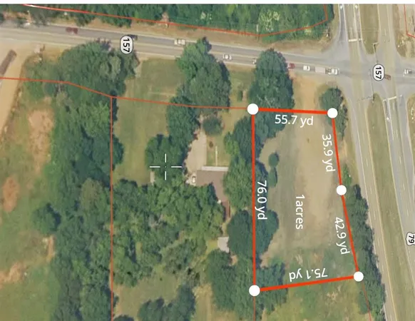 an aerial view of houses with yard