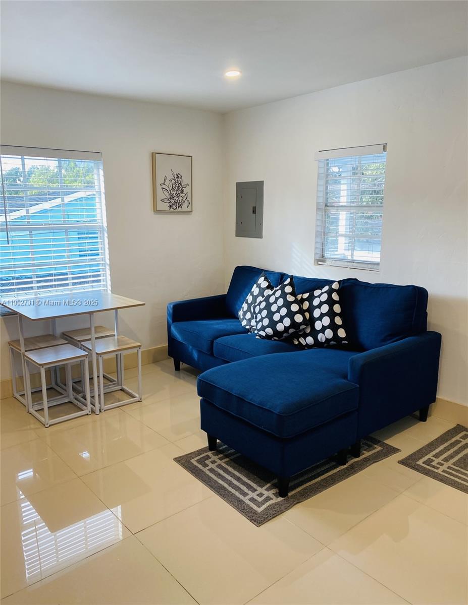 227 Northwest 34th Street, Unit 3 Miami, FL 33127 - Photo 5 of 6 a living room with furniture