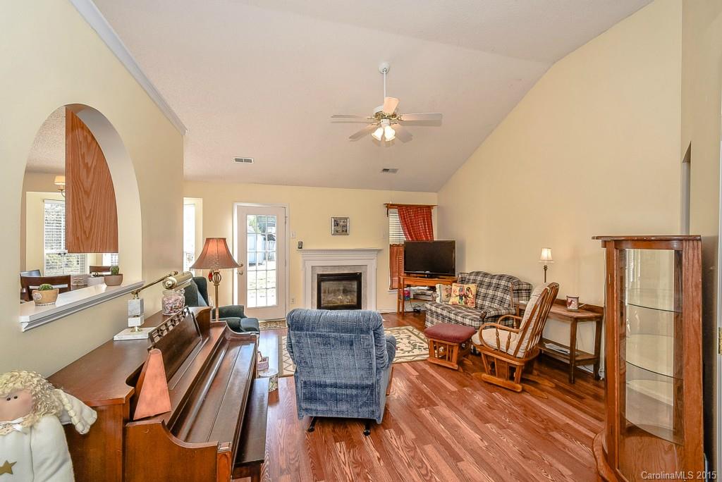 4004 Lake Park Road Indian Trail, NC 28079 - Photo 2 of 19 a living room with furniture fireplace and dining table