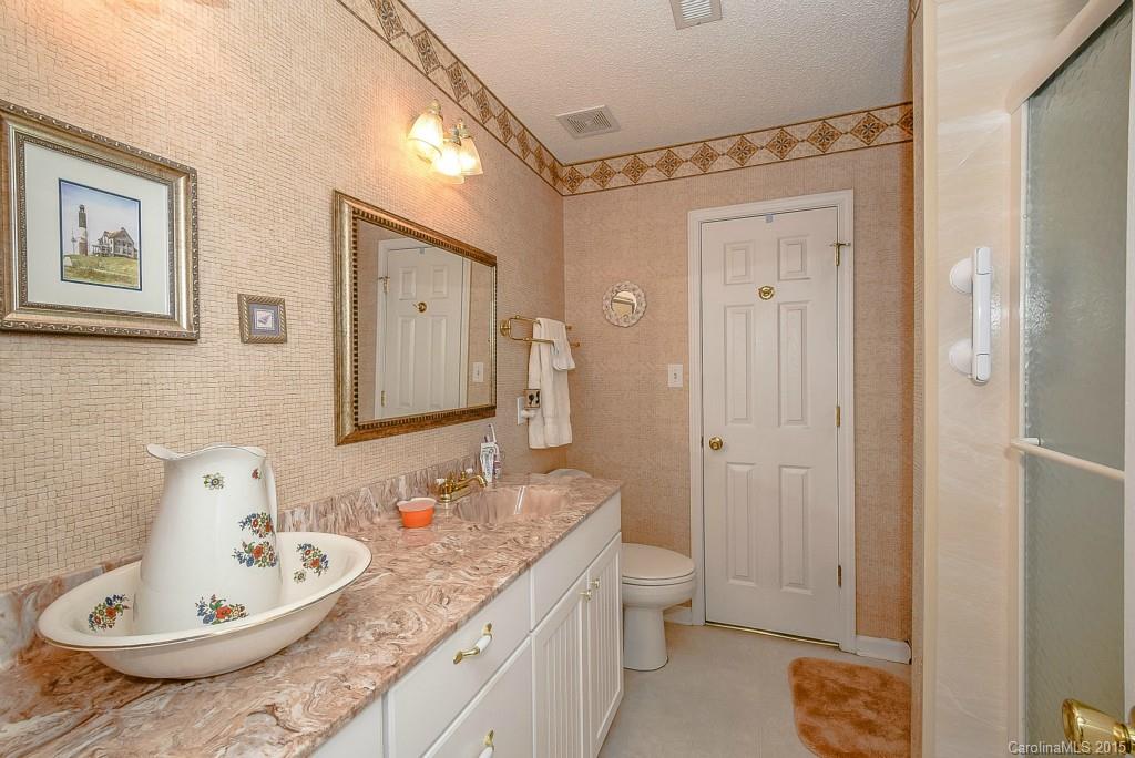 4004 Lake Park Road Indian Trail, NC 28079 - Photo 11 of 19 a bathroom with a granite countertop sink and a mirror