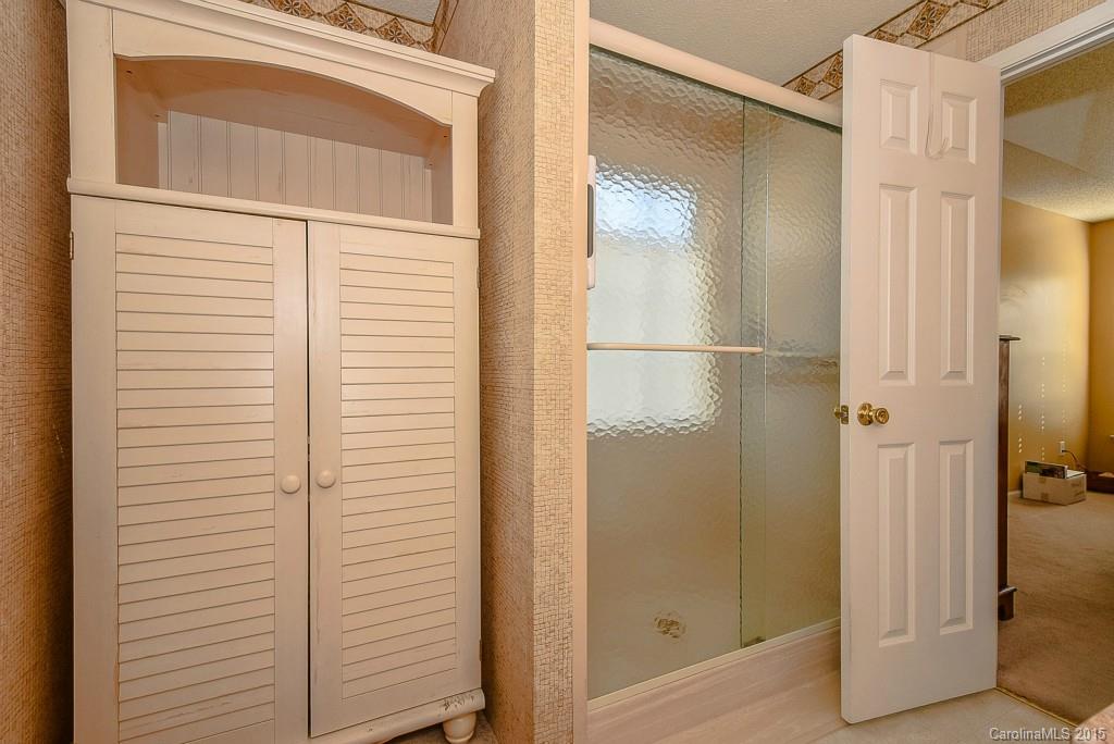 4004 Lake Park Road Indian Trail, NC 28079 - Photo 12 of 19 a bathroom with a glass shower door