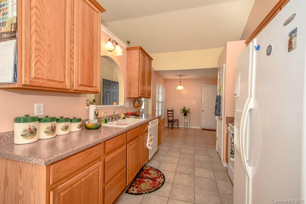 4004 Lake Park Road Indian Trail, NC 28079 - Photo 7 of 19 a kitchen with a sink and a refrigerator