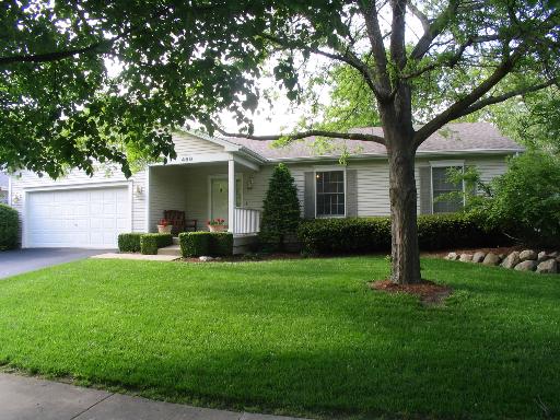 469 Spring Street Geneva, IL 60134 - Photo 1 of 1 a front view of house with yard and green space