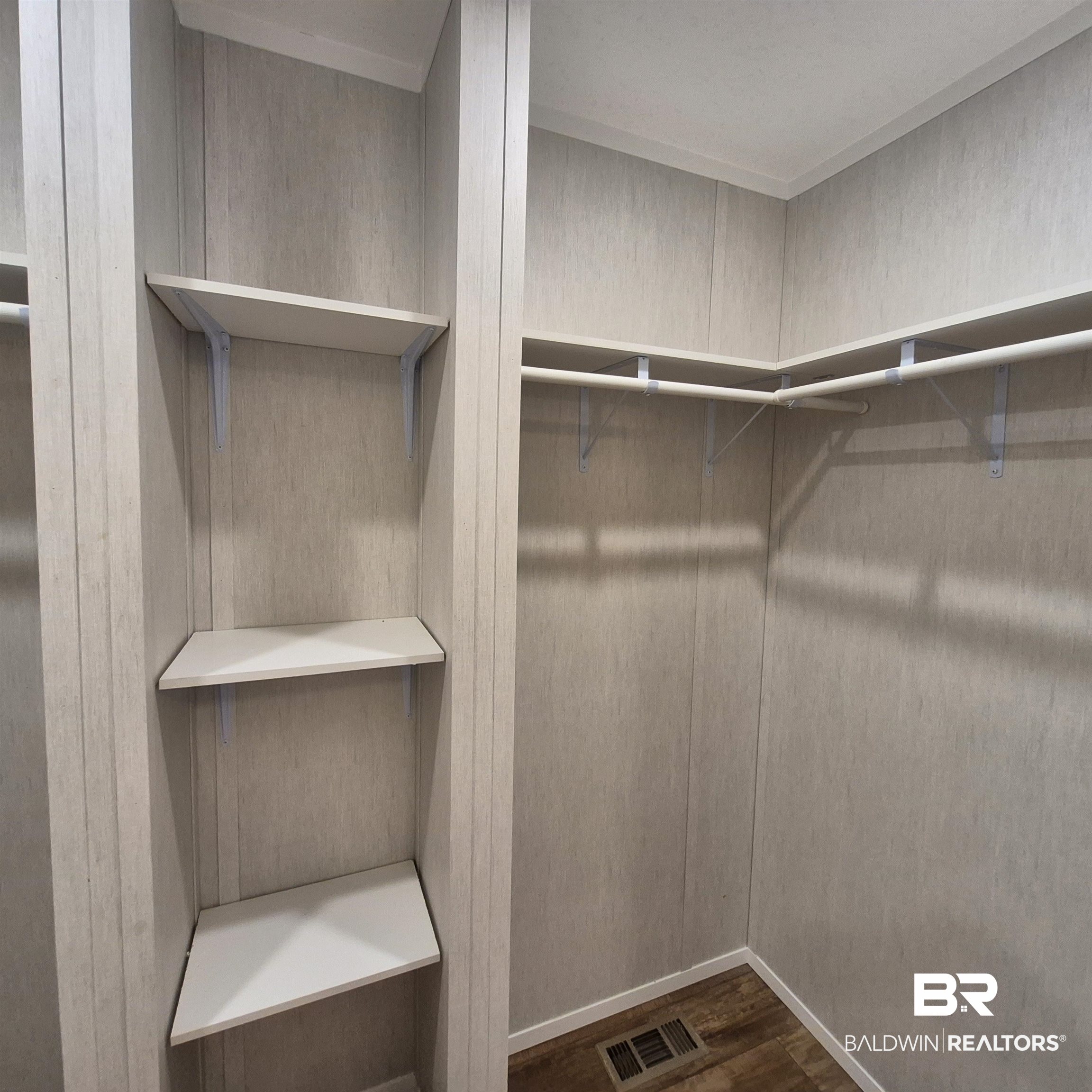 8867 Old Stage Road Repton, AL 36475 - Photo 22 of 37 Spacious closet featuring dark wood-style flooring