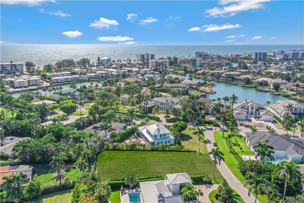 350 Rudder Road Naples, FL 34102 - Photo 9 of 14 an aerial view of a city with lots of residential buildings