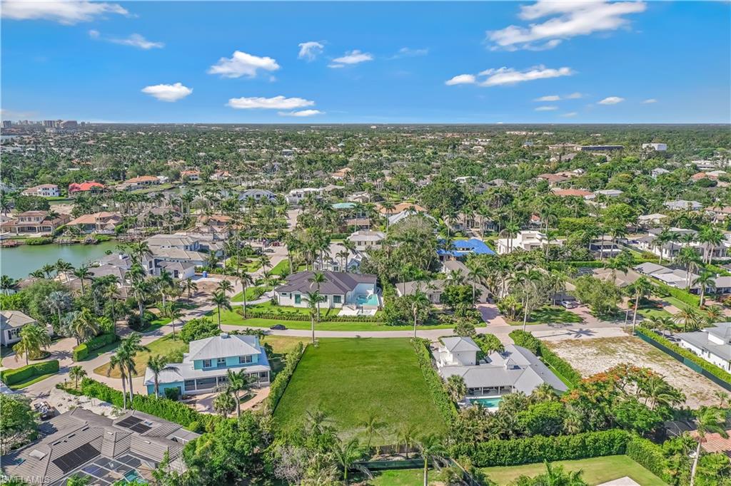 350 Rudder Road Naples, FL 34102 - Photo 10 of 14 an aerial view of residential houses with outdoor space and trees