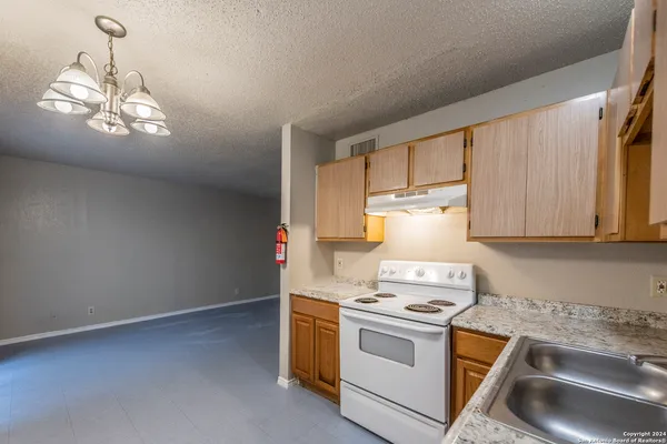 a kitchen with a stove and a sink
