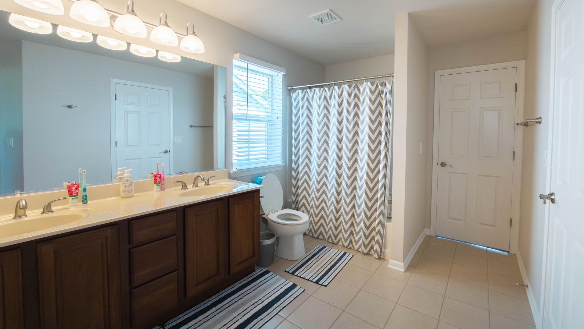421 Post Oak Circle West Chicago, IL 60185 - Photo 15 of 22 a bathroom with a sink mirror and a toilet