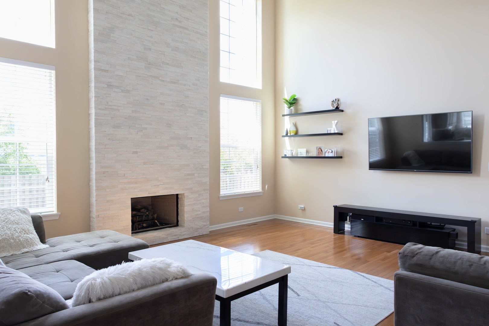 421 Post Oak Circle West Chicago, IL 60185 - Photo 6 of 22 a living room with furniture a flat screen tv and a fireplace