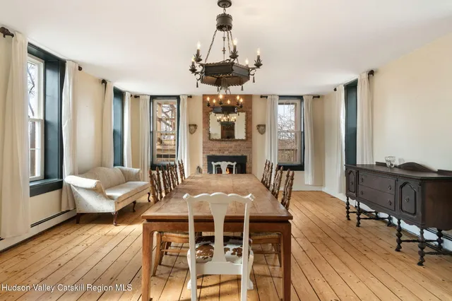 a view of a livingroom with furniture window and wooden floor