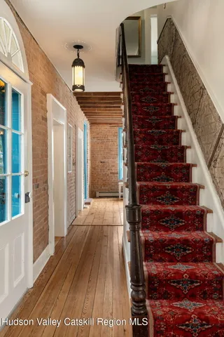 a view of entryway with wooden floor