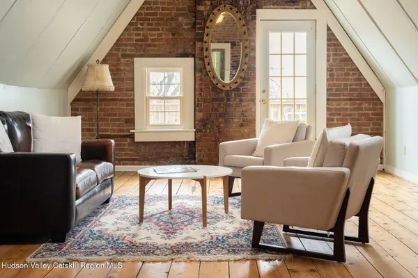 a view of white kitchen with granite countertop stainless steel appliances