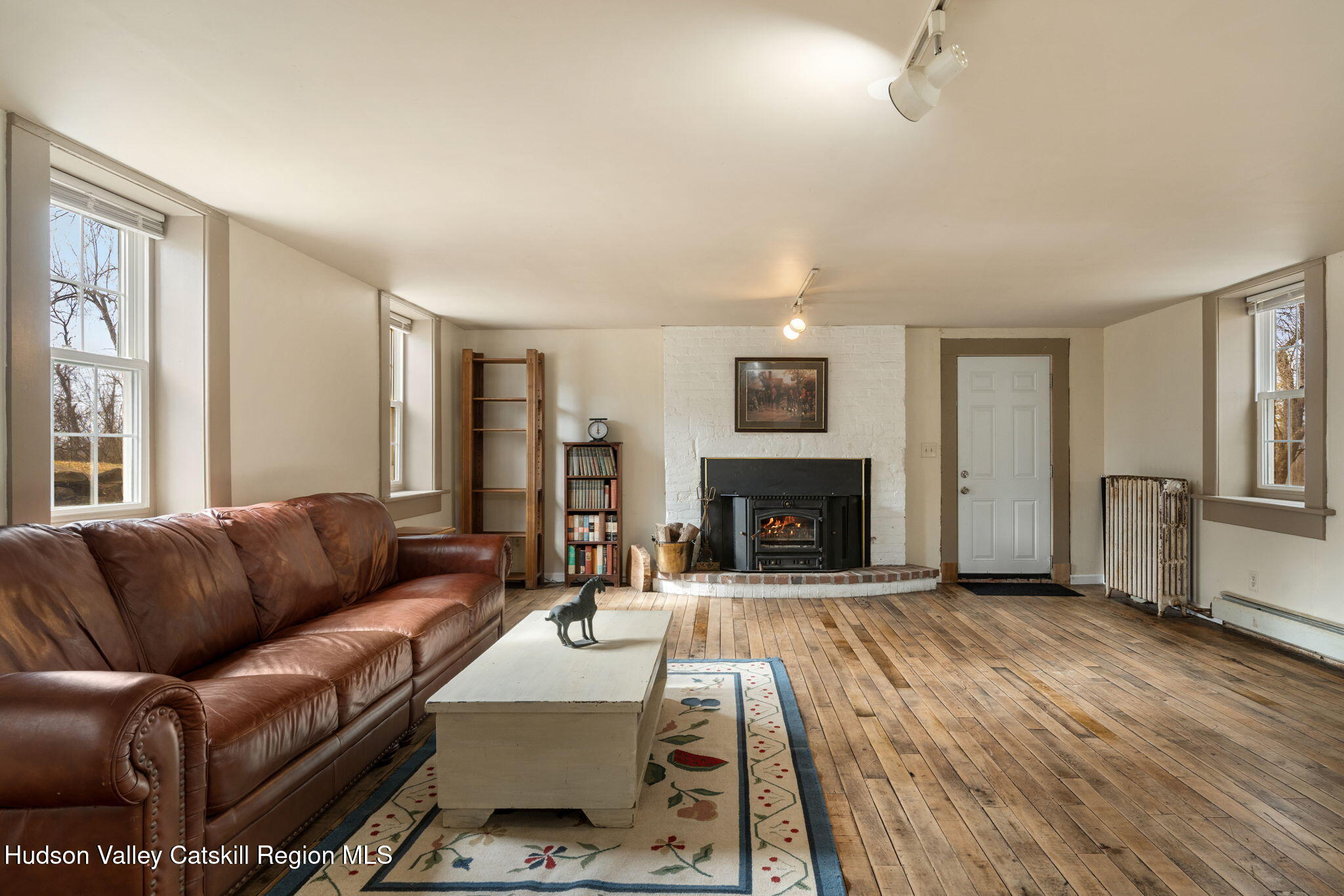 2125 Highway 385 Athens, NY 12015 - Photo 45 of 50 a living room with furniture and a fireplace