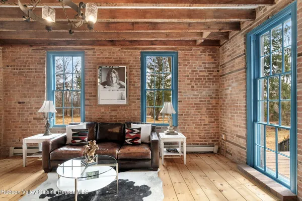 a balcony with furniture and a potted plant
