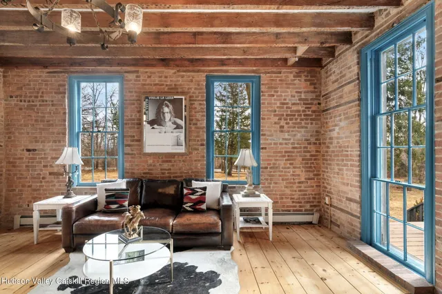 a balcony with furniture and a potted plant