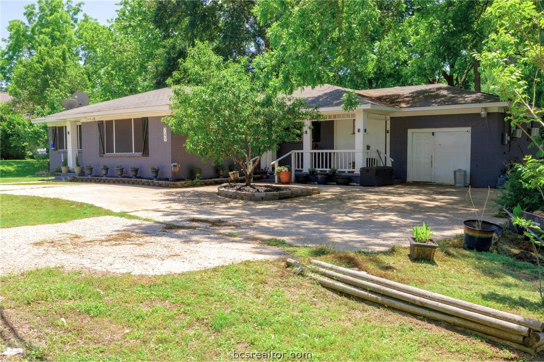 749 South Cass Street Centerville, TX 75833 - Photo 1 of 30 a view of a house with a yard and sitting area