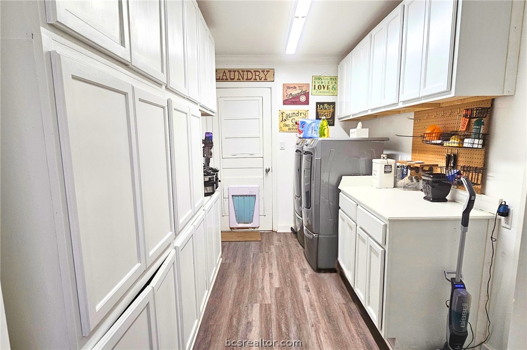 749 South Cass Street Centerville, TX 75833 - Photo 15 of 30 a view of a kitchen with fridge and wooden floor