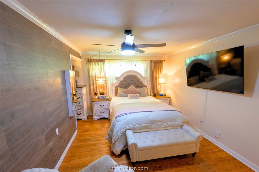 749 South Cass Street Centerville, TX 75833 - Photo 17 of 30 a bedroom with a bed and a flat screen tv