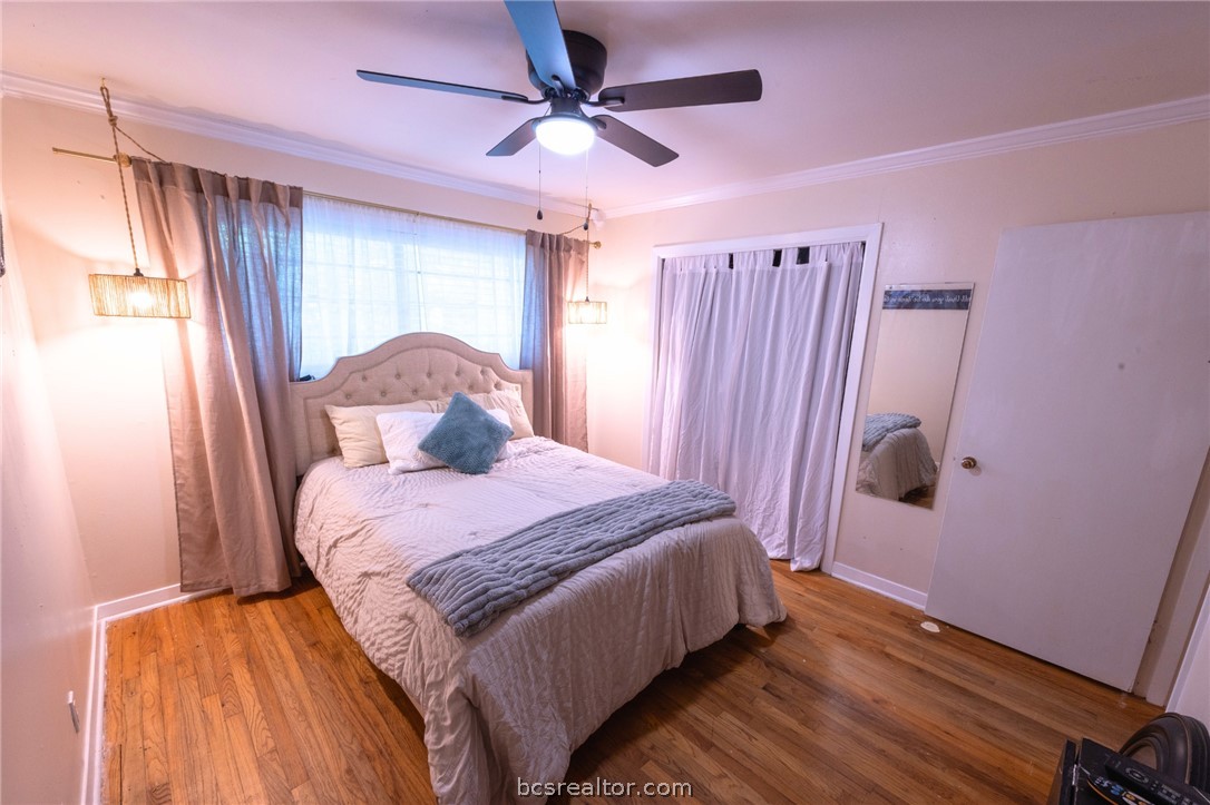 749 South Cass Street Centerville, TX 75833 - Photo 19 of 30 a bedroom with a bed and a window