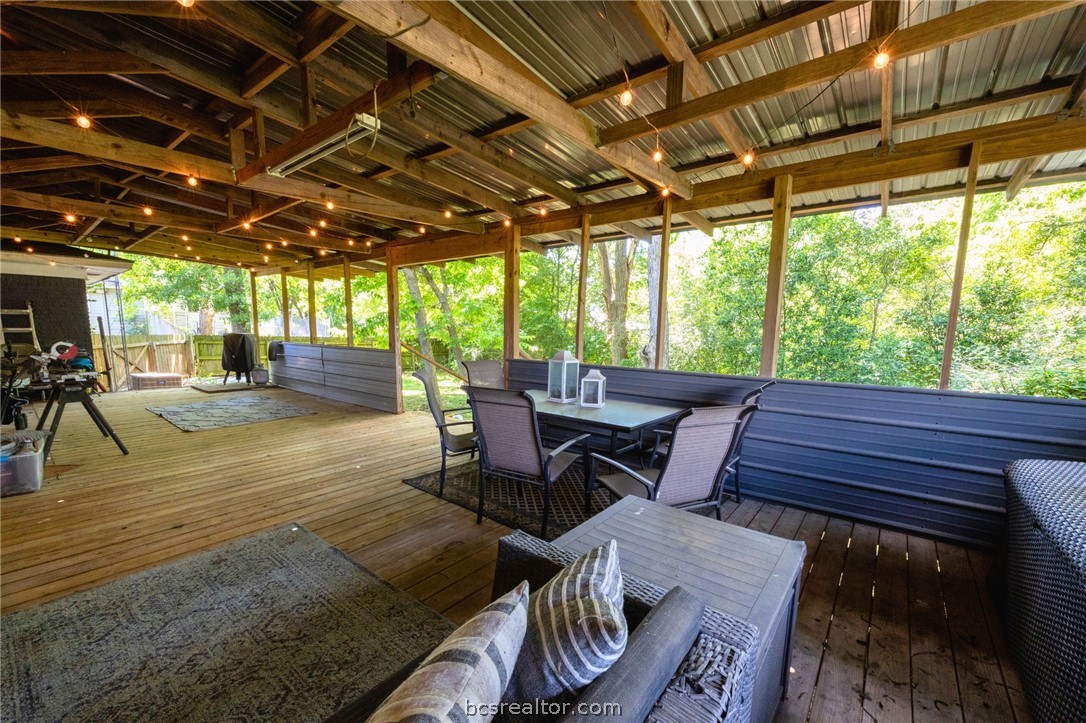 749 South Cass Street Centerville, TX 75833 - Photo 24 of 30 a patio with glass top table and chairs