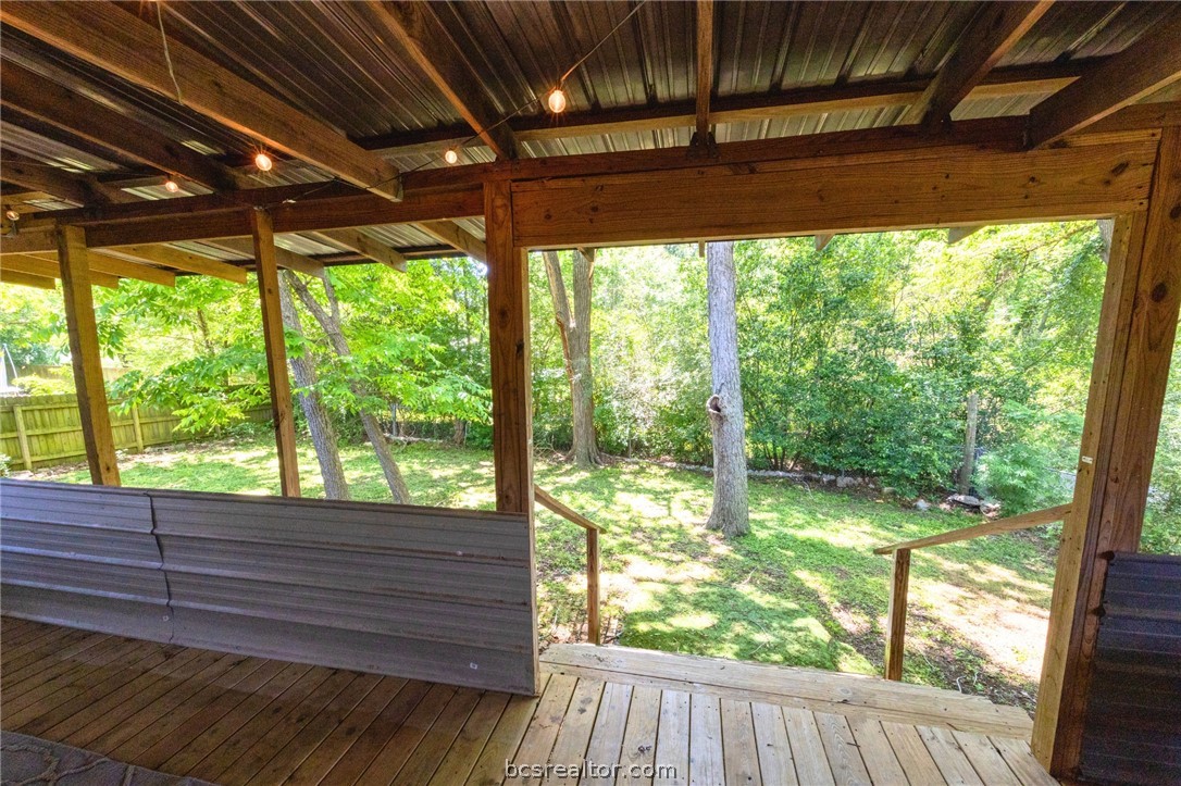 749 South Cass Street Centerville, TX 75833 - Photo 26 of 30 a view of room with wooden floor and outdoor space