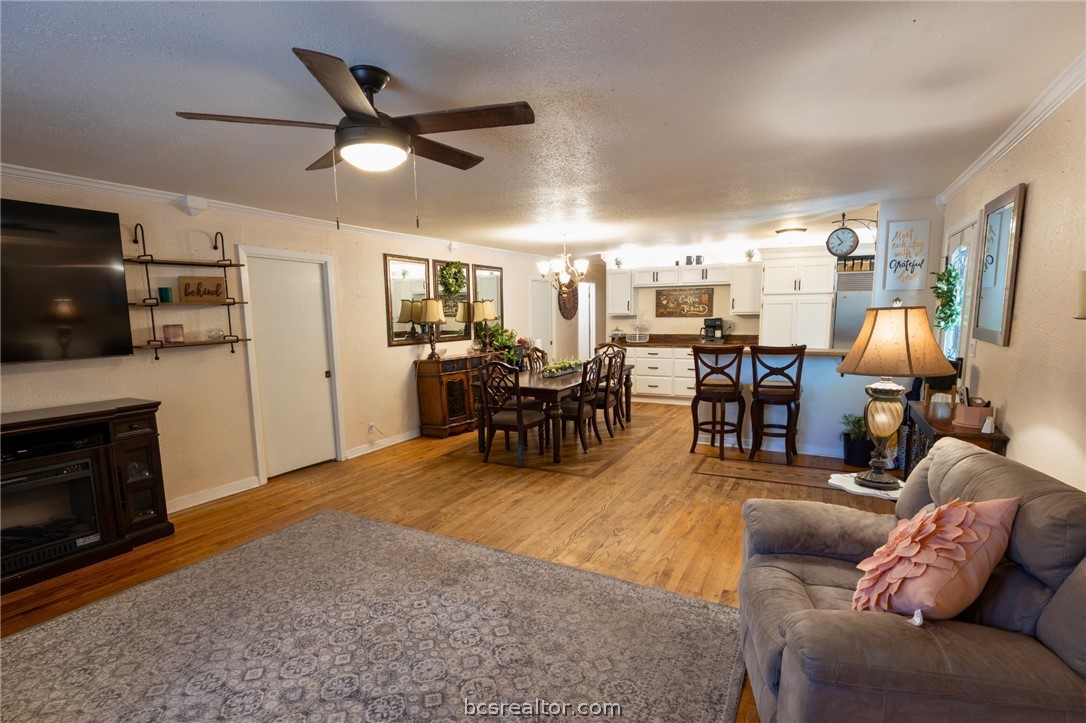 749 South Cass Street Centerville, TX 75833 - Photo 5 of 30 a living room with furniture kitchen view and a fireplace