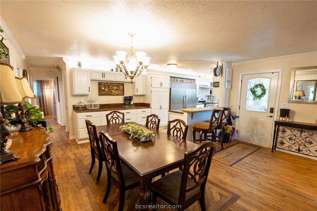 749 South Cass Street Centerville, TX 75833 - Photo 6 of 30 a view of a dining room with furniture and wooden floor