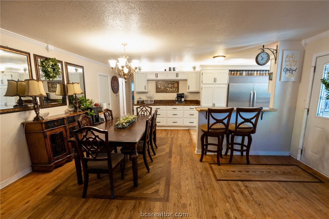 749 South Cass Street Centerville, TX 75833 - Photo 7 of 30 a view of a dining room with furniture and wooden floor
