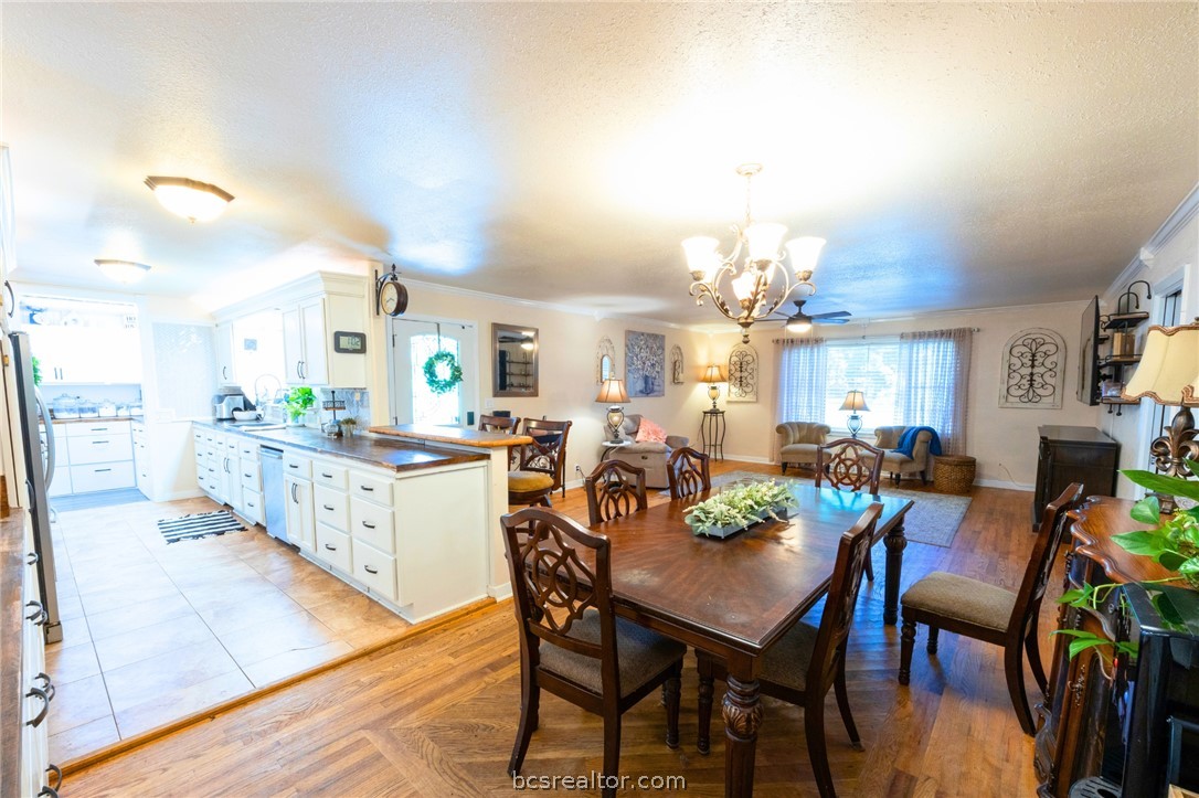 749 South Cass Street Centerville, TX 75833 - Photo 8 of 30 a view of a dining room with furniture and a chandelier
