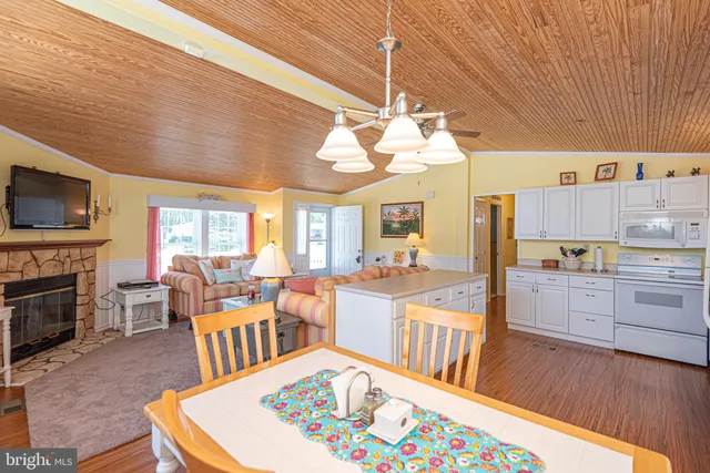 a very nice looking open dining room with kitchen island furniture