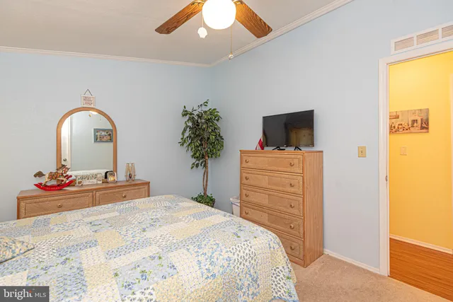 a bedroom with a bed and a television