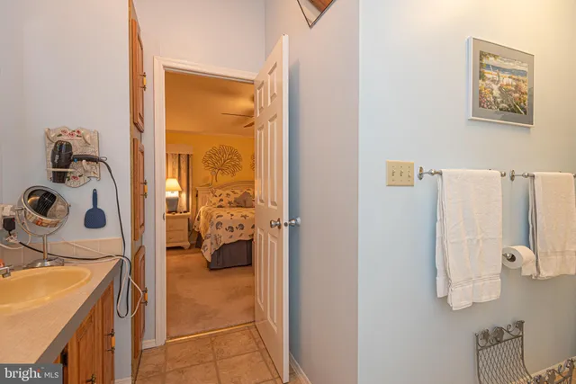 a view of a bedroom with a bed and a window