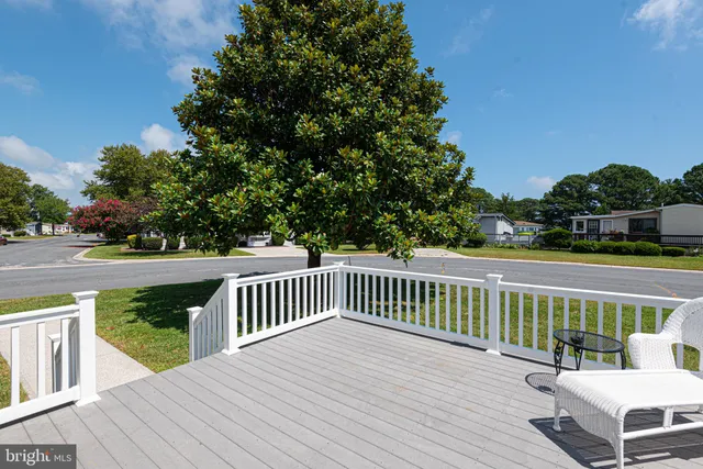 a view of a two chairs on the roof deck