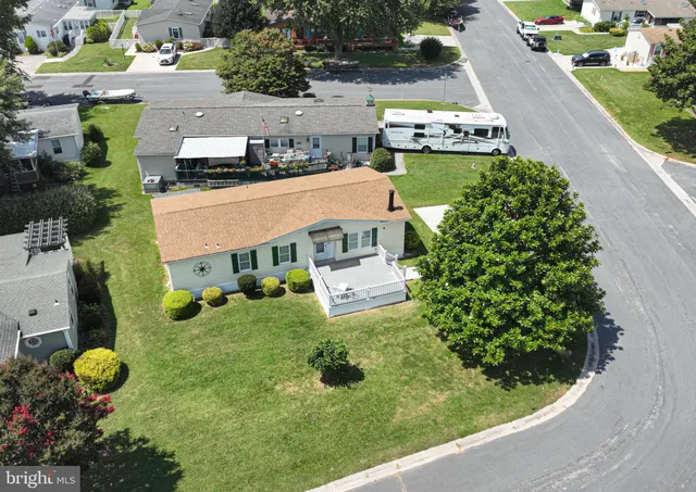 an aerial view of a house with yard swimming pool and outdoor seating
