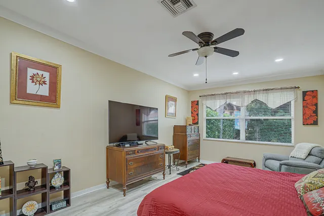 a spacious bathroom with a double vanity sink mirror and bathtub