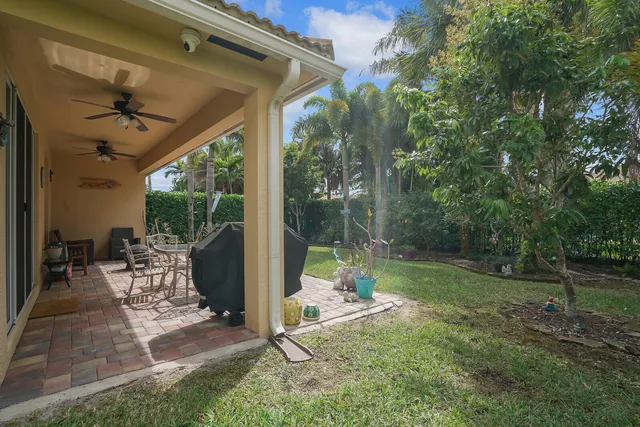 a view of a house with outdoor space and a garden