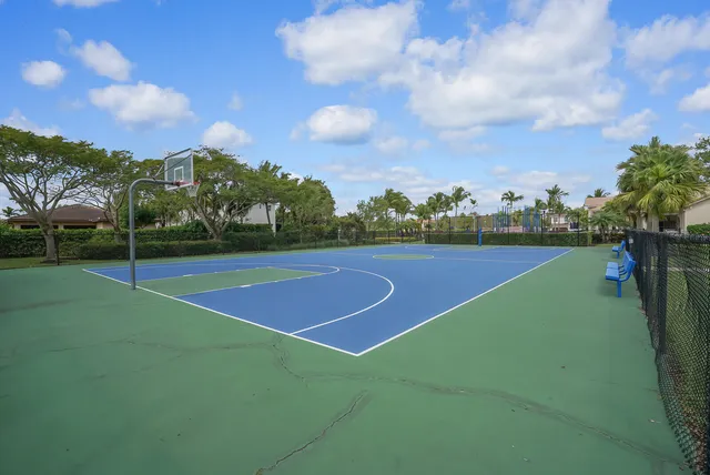 a front view of a house with a garden and a yard