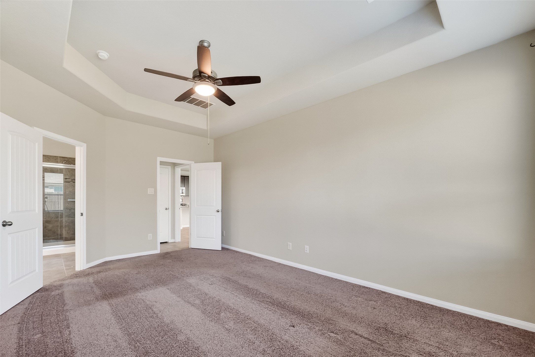 5 Lucas Chase Court Manvel, TX 77578 - Photo 17 of 50 Spacious and thoughtfully designed, this primary suite offers direct access to the en-suite bath, a linen closet for extra storage, and plenty of room to create your ideal retreat.