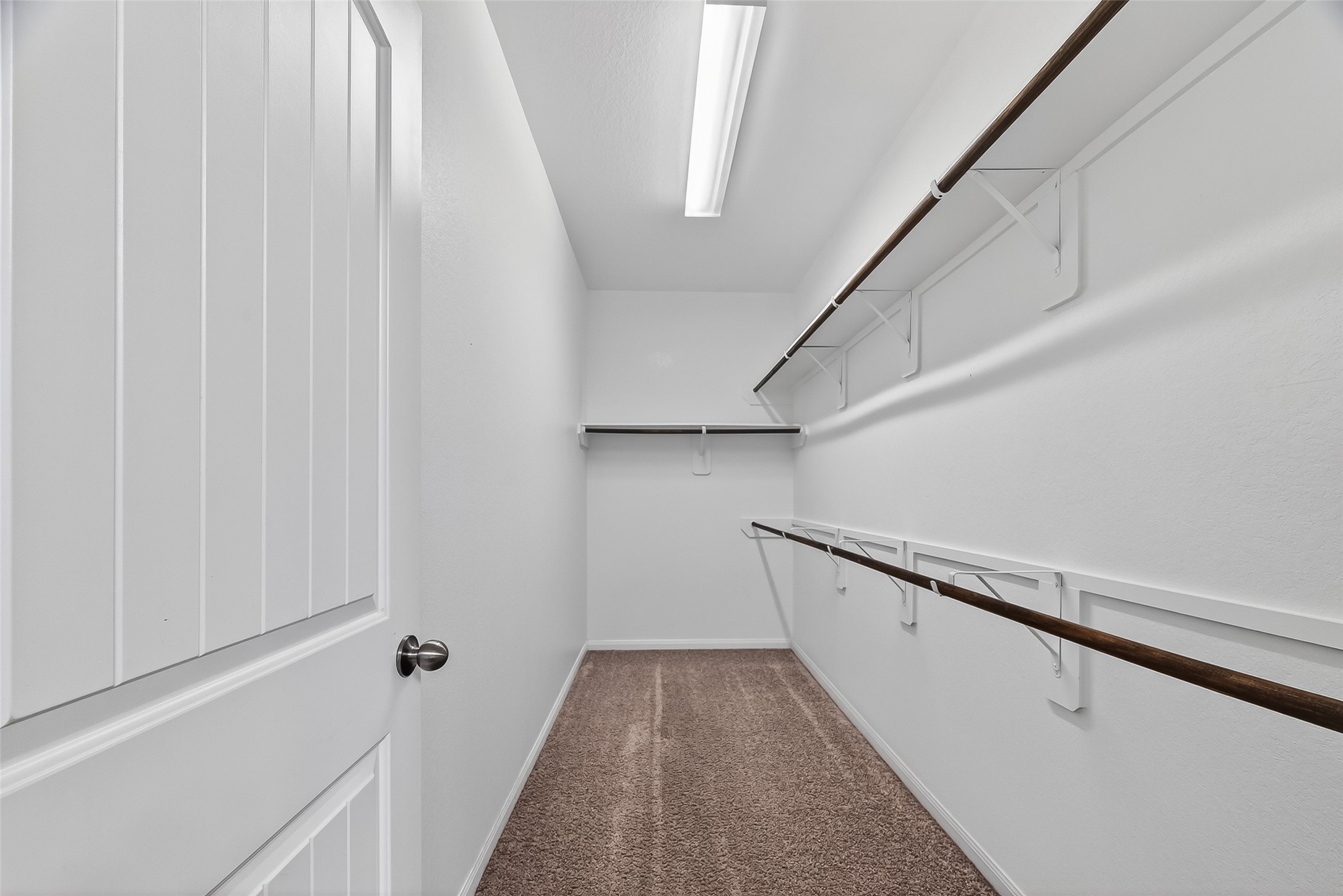 5 Lucas Chase Court Manvel, TX 77578 - Photo 21 of 50 Closet goals! This spacious walk-in closet makes staying organized effortless with plenty of room for clothes, shoes, and everything in between — right off the primary bath for ultimate convenience.