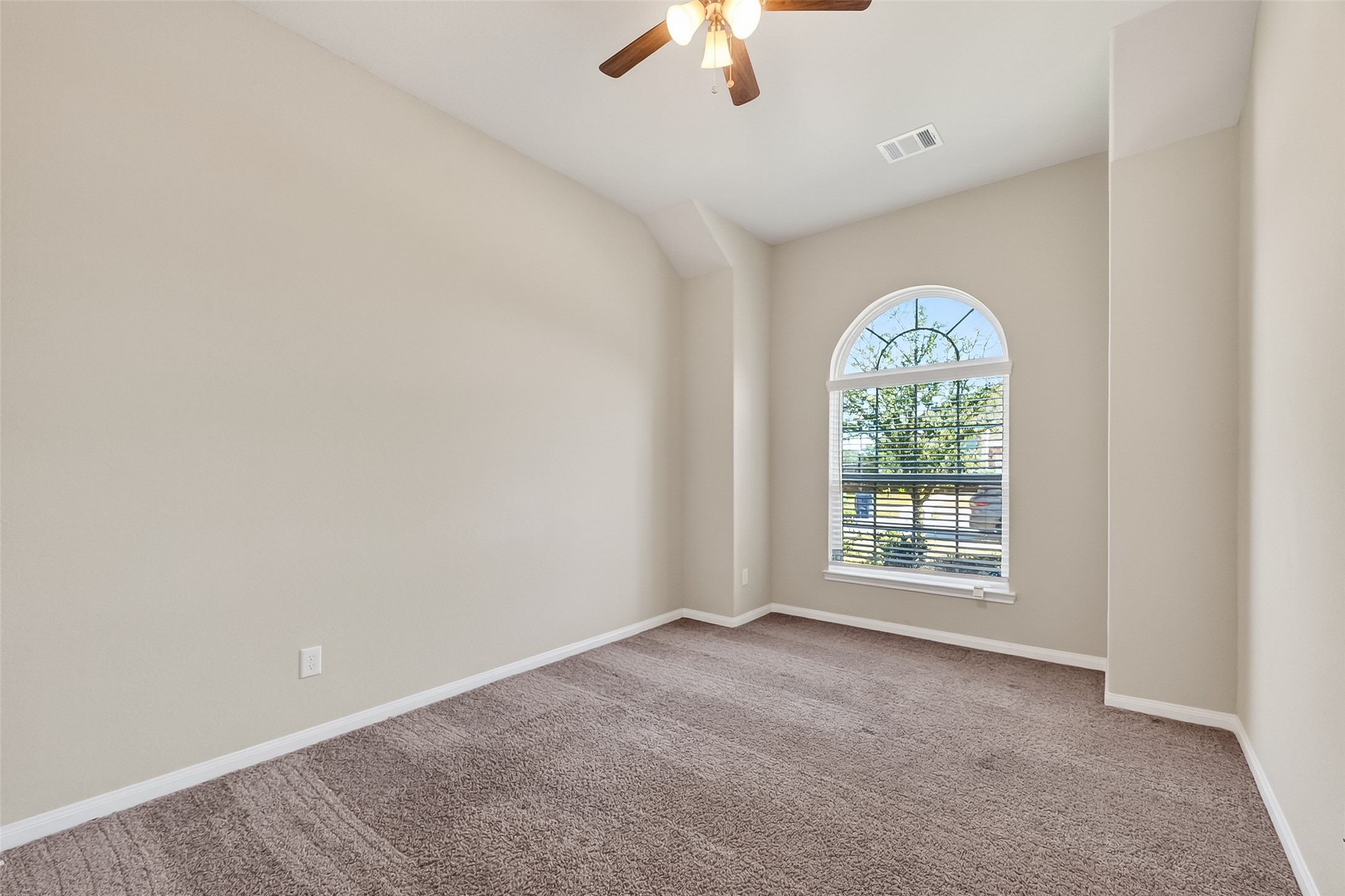 5 Lucas Chase Court Manvel, TX 77578 - Photo 23 of 50 This light-filled second bedroom offers endless flexibility—perfect as a cozy guest room, inspiring home office, or your personal wellness space. Big window, great vibes, and even better potential.