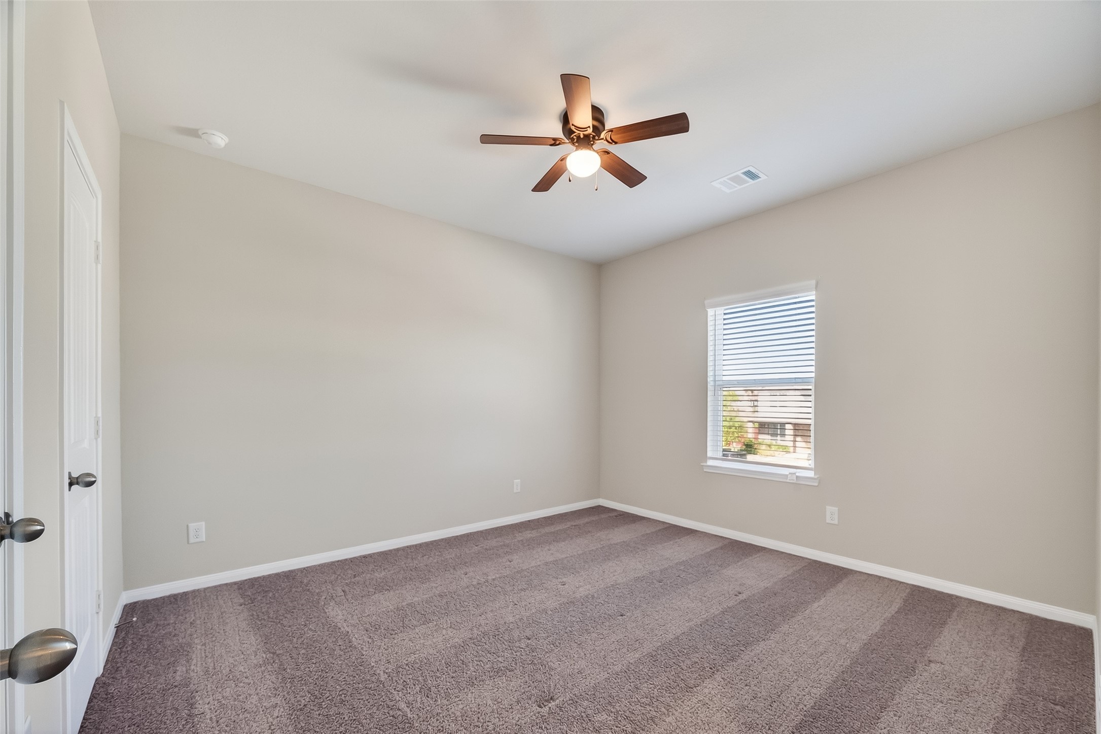 5 Lucas Chase Court Manvel, TX 77578 - Photo 32 of 50 This upstairs bedroom offers the perfect mix of privacy and space, with a ceiling fan, great light, and a closet that keeps things tidy and accessible.