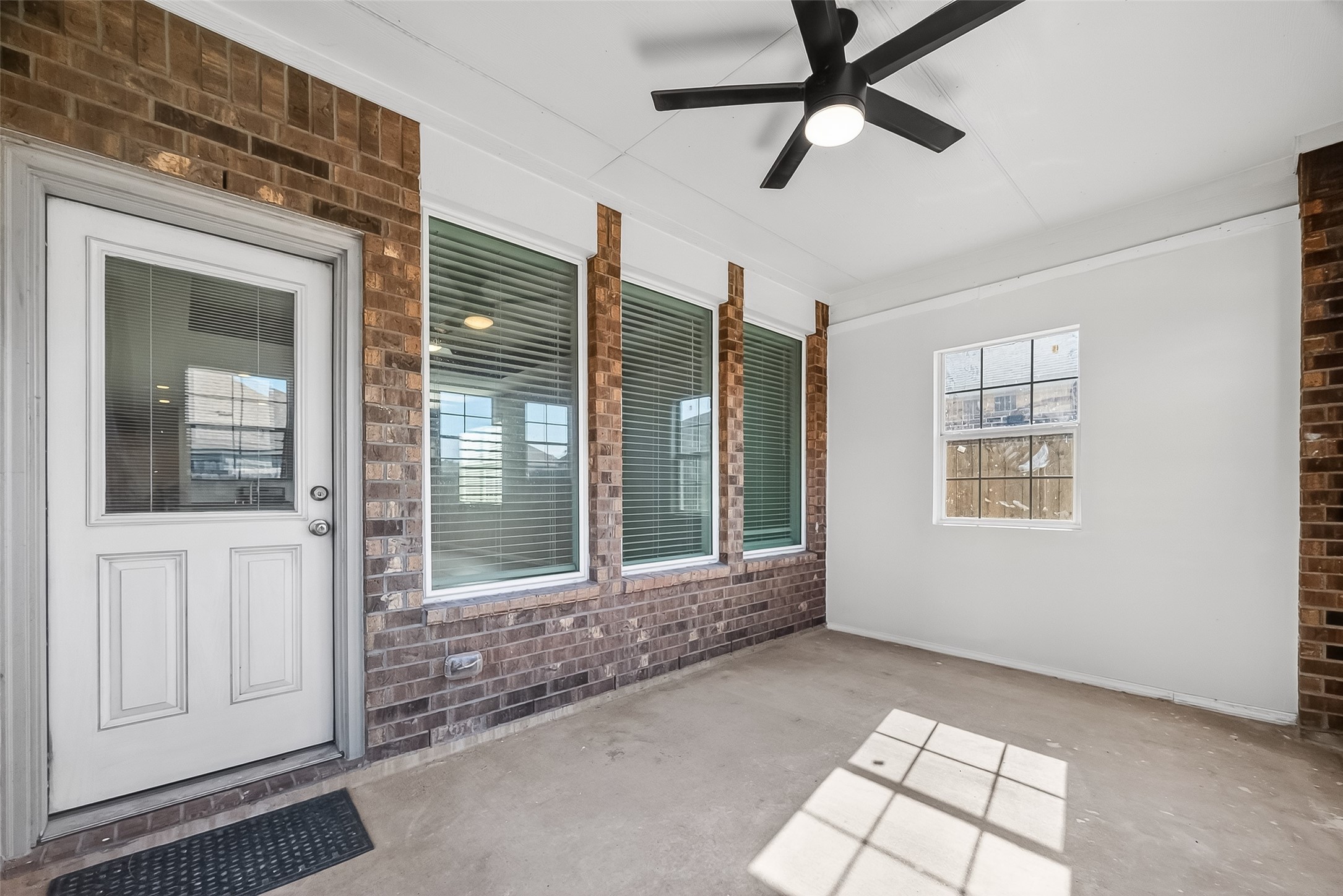 5 Lucas Chase Court Manvel, TX 77578 - Photo 36 of 50 This enclosed patio is the perfect year-round retreat—ideal for morning coffee, evening wind-downs, or even a play space or hobby zone. Rain or shine, this space works for your lifestyle.