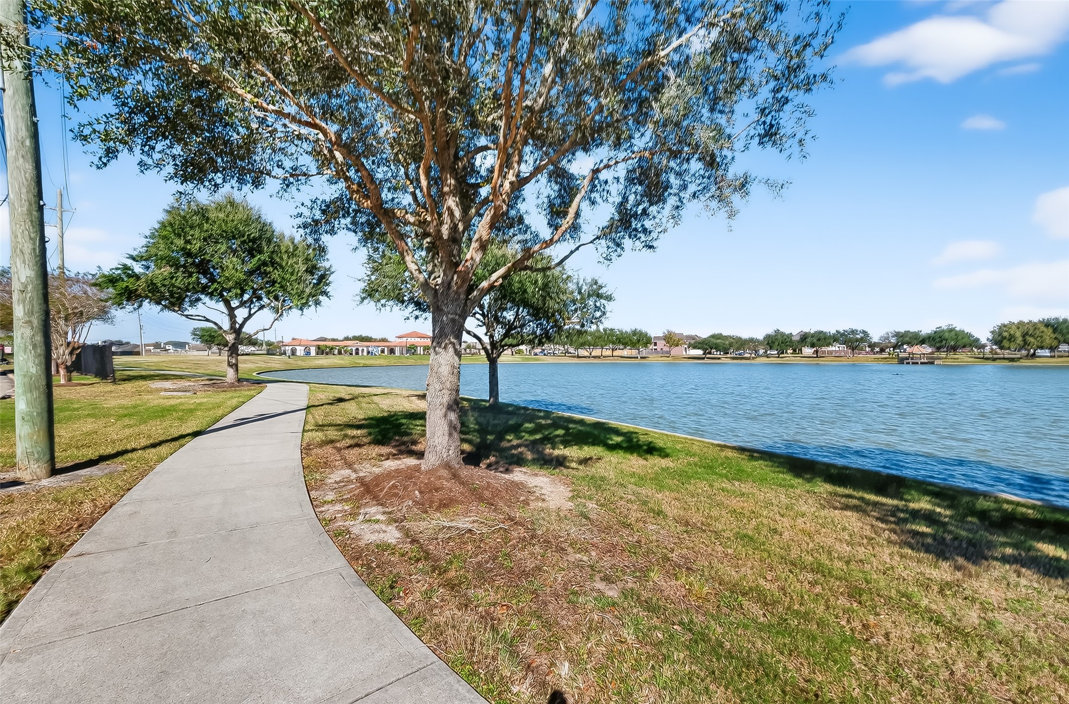 5 Lucas Chase Court Manvel, TX 77578 - Photo 47 of 50 Walk, run, or bike! Take advantage of the dedicated scenic trails lining the community lake. Enjoy the peaceful, secure environment that makes this gated community so desirable.