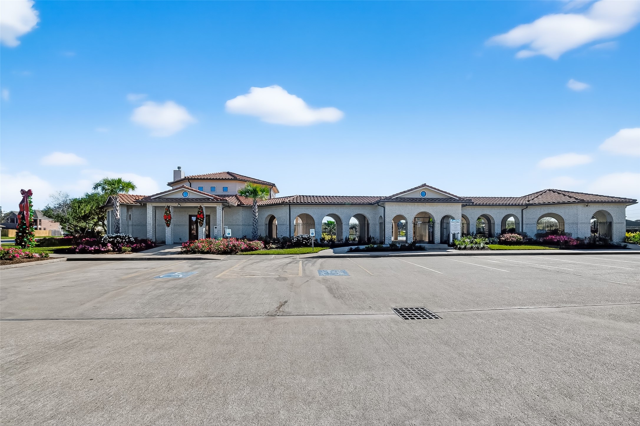 5 Lucas Chase Court Manvel, TX 77578 - Photo 49 of 50 Your Resort Lifestyle Starts Here! The stunning community clubhouse is the social hub, featuring beautiful architecture and offering activities just steps from your front door.