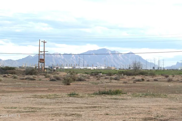 a view of a road with an ocean beach