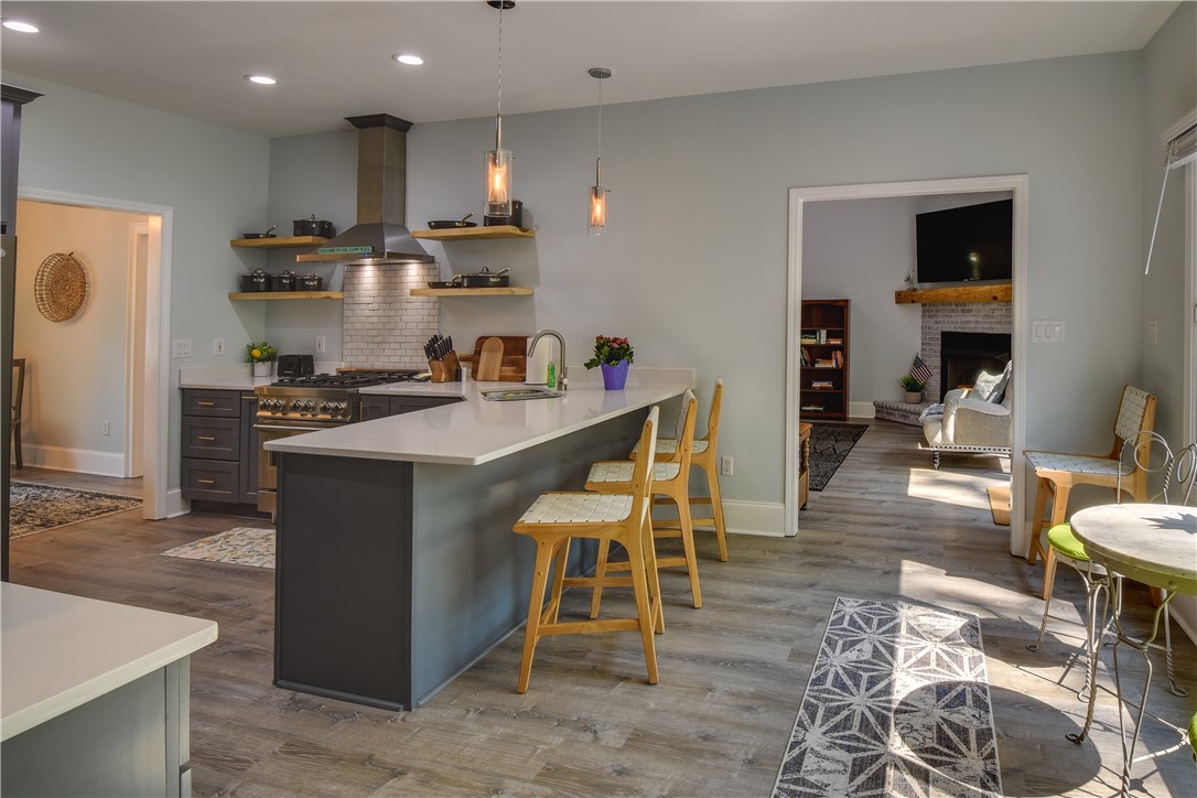 206 Petty Road Seneca, SC 29672 - Photo 13 of 48 Culinary delights await in this bright kitchen with an inviting island and seamless flow to the living area.
