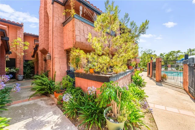 a view of a house with a door and wooden walls