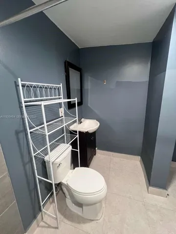a bathroom with a toilet and a sink