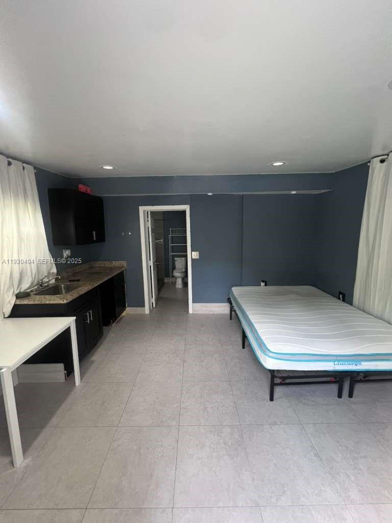 3101 Southwest 14th Street, Unit 1 Fort Lauderdale, FL 33312 - Photo 5 of 6 a room with furniture